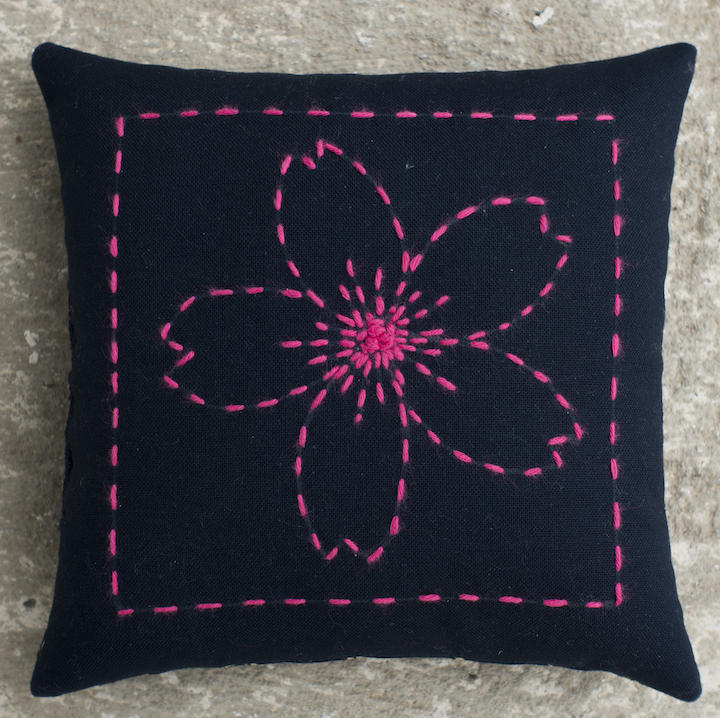 Cherry Blossom Sashiko pin cushion kit includes pre printed solid lines for stitching. Design washes out. Sashiko thread and backing included. 100% cotton Finished size 5 x 5 inches.Sale $5.60 was $7.00