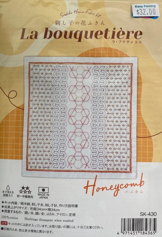 Honeycomb pre printed white panel kit. Includes gold,brown,tan and orange threads. Needle not included. finishes 12 x12. Sashiko and weaving technique. $32.00- sale $24.00
