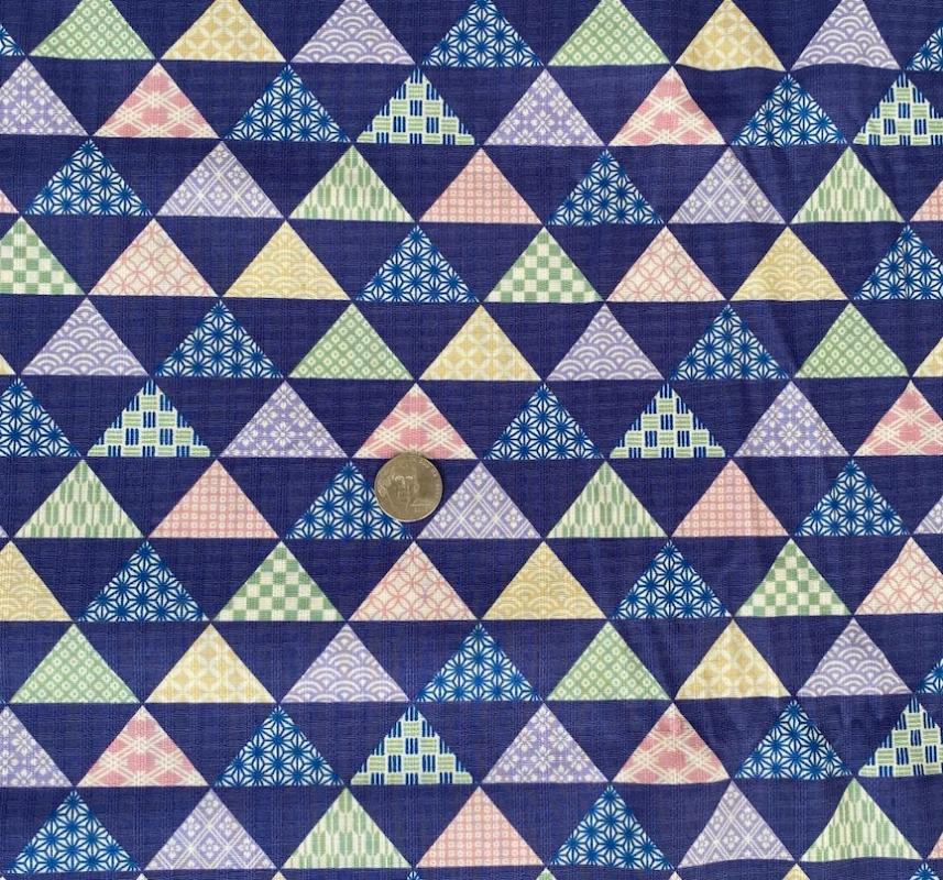 Multi triangles on purple background- lightweight cotton-  sale $12.60 yd-  was $15.75