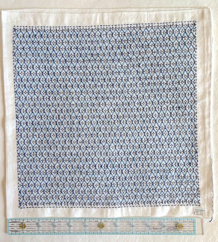 Kikko flower vase with navy and bright blue thread on white Sashiko fabric. Stitched through 1 layer. Has a solid white back. $15.00