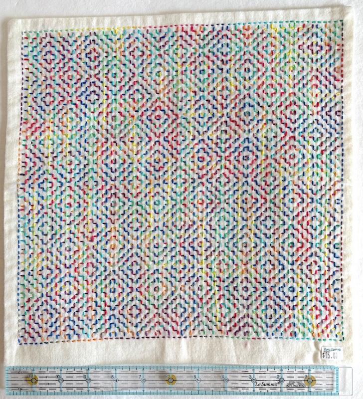 Summer no flowers with bright rainbow variegated thread on white Sashiko fabric. Stitched through 1 layer. Has a solid white back. Edges sewn. ready for a pillow $15.00