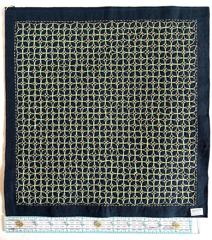 Morning glory with yellow & bright green thread on navy Sashiko fabric. Stitched through 1 layer. Has a solid navy back. $15.00